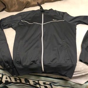 Black nike jacket with zipper and hood. Unisex